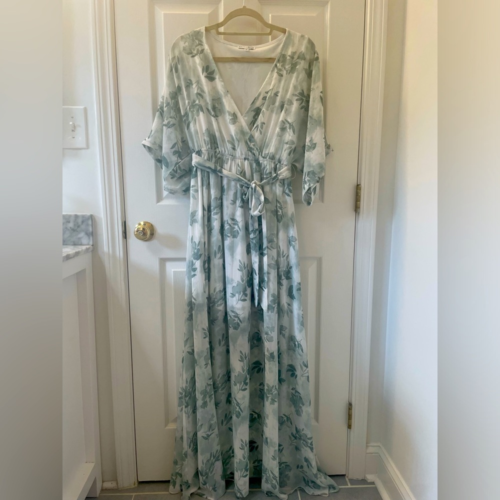 White maxi dress with green flowers. It’s a wrap dress.